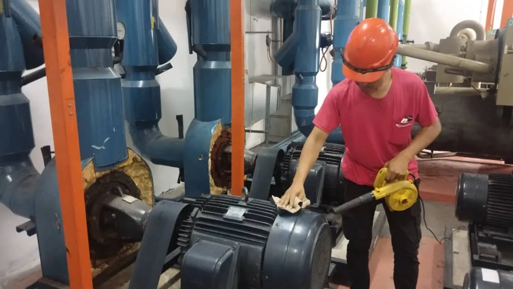 Technician performing water pump repair in Penang for industrial system maintenance