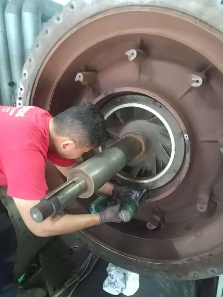 Engineer inspecting bearings as part of Trane chiller Malaysia overhaul